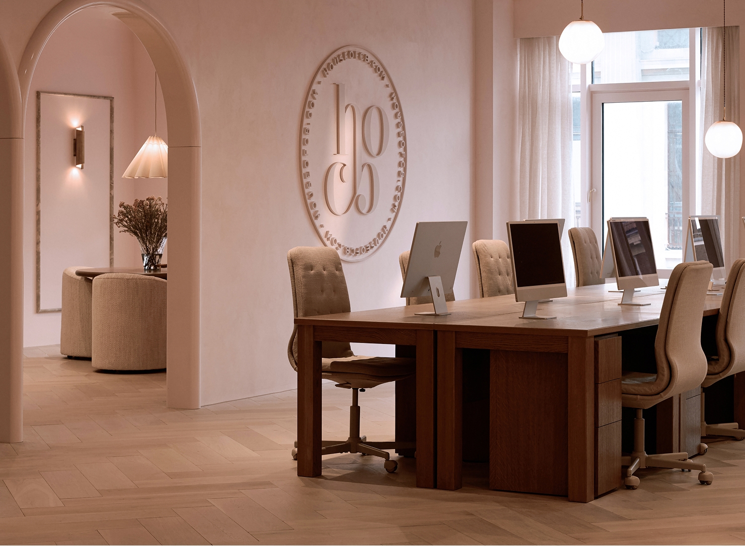 House of CB head office, Oxford Street, London — iMac workstations beneath the embossed brand seal